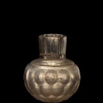 Bottle, clear, green tinge, free blown and cut. Near East, probably Persia, ca. 9th-10th century. H: 7.9-8.2 cm.