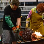 Laura Donefer and Jeff Mack working with hot glass at Corning