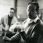 Littleton applying slip to a ceramic bowl, with Tom McGlauchlin in the background (Marvin Lipofsky Archive, Rakow Library, The Corning Museum of Glass).