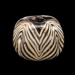 Bead with Feather Pattern, wound, applied, marvered. Ancient Islamic, 600-799. H: 2.1 cm, Diam: 2.6 cm. (95.1.36, bequest of Jerome Strauss)