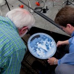 Nick and Andy adjust the cameo plate into position to be photographed