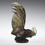 Automobile Mascot, Paperweight, or Bookend, Coq nain (Bantam rooster), mold-pressed glass. René Lalique (French, 1860–1945). France, Combs-la-Ville or Wingen-sur-Moder, designed 1928. H. 20.2 cm, W. 13.5 cm, D. 6.7 cm. The Corning Museum of Glass (2011.3.402, gift of Elaine and Stanford Steppa)