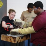 Jessi Moore working with the Immersion in Glass Studies Program in August of 2013.