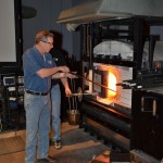 Don Pierce works on a piece on an old Hot Glass Show stage.