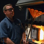 Don Pierce works on a piece on an old Hot Glass Show stage.