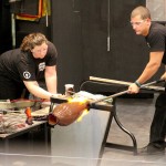 The Hot Glass Demo team works on the first piece officially made in the Amphitheater Hot Shop