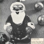 A Black and white image of a Santa Claus ornament.