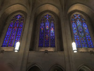 Three stained glass windows lining the nave of one side of the Church of the Heavenly Rest, New York City. The Whitefriars monks on the bottom right corners of these windows are so small compared to the scale of the windows, they required binoculars to view!