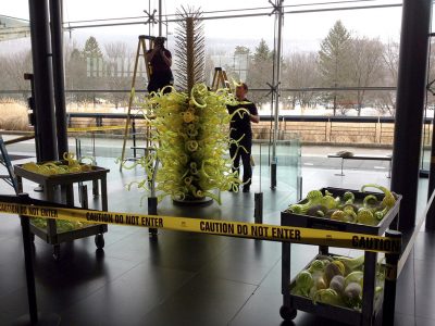 Chihuly's Fern Green Tower is re-assembled after cleaning.