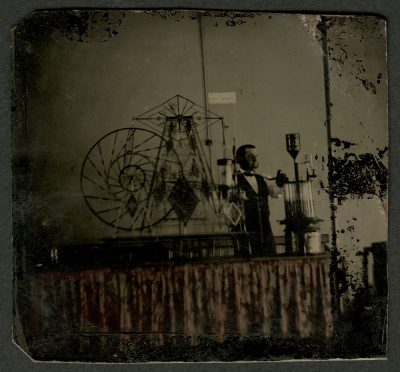 Tintype of glassworker and glass steam engine