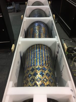 The large Tiffany mosaic column still in its crate.