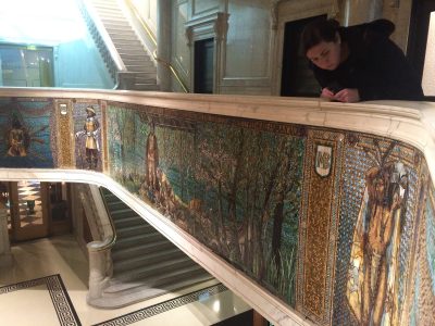 Co-curator Kelly Conway takes in the details of the mosaic at the Marquette Building in Chicago.