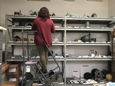 Emily Smith, Assistant Registrar, checks that loan objects are accounted for before they are packed.