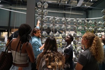 Marvin Bolt, curator of science and technology, gives students a tour of the Innovation Center.