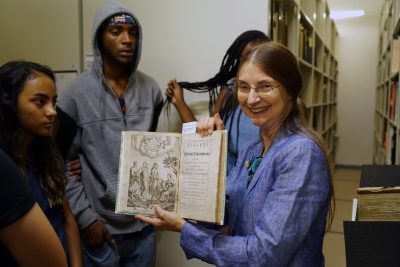 Librarian Beth Hylen gives students a tour of the special collections at the Rakow Research Library.