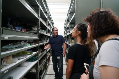 Collections manager Warren Bunn leads students on a tour of collections storage.