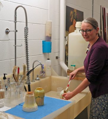 Fig. 1: Washing the lampshades.